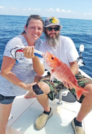 Mary & Justin aboard the C-note boat haulin snapper.