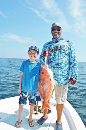 Nicholas and Capt. C-note haulin’ snapper