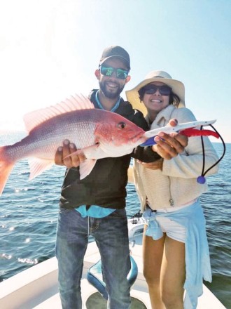 Omar ‘n Valentina bagging snapper aboard the C-note boat.