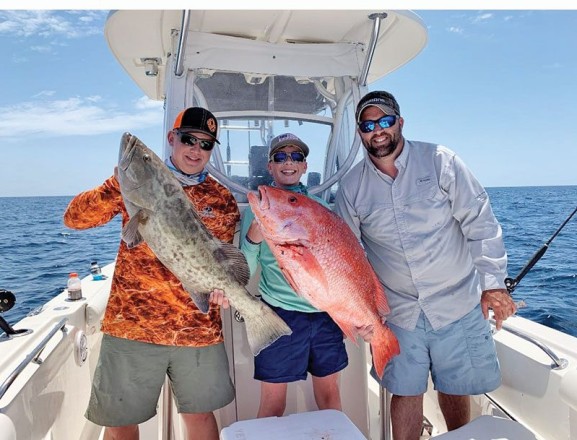 Parker Gillman, Landon Celona & Brian Beighey loading the boat