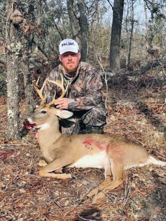 Phillip Hicks, founder of Pool Commander, with an 8-point Bay Co. buck.