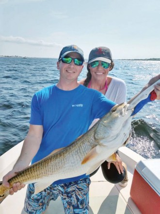 Siblings Patrick & Laura hauling in redfish