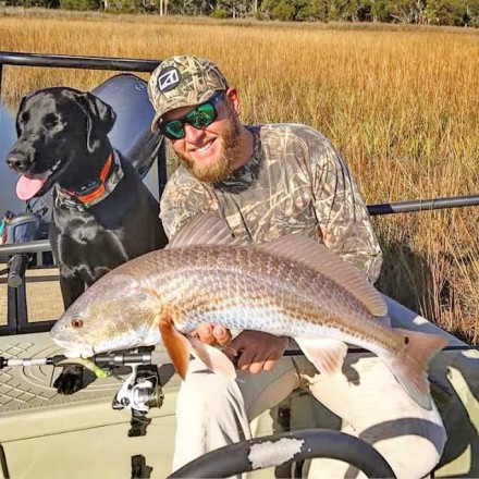 Capt. Jordan Todd and his best friend Murphy Dog nab a red.