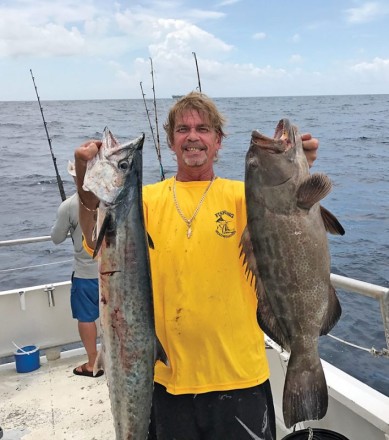 Greg with a nice kingfish and grouper