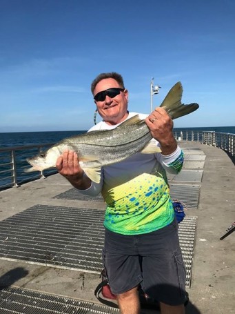 Harry Johnson of Melbourne fishing at Sebastian Inlet.  Snook was released
