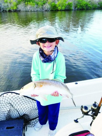 On his last day of summer vacation 7  year old Isaac Taylor caught this 22 inch Red Fish while fishing with his grandpa on the Indian River