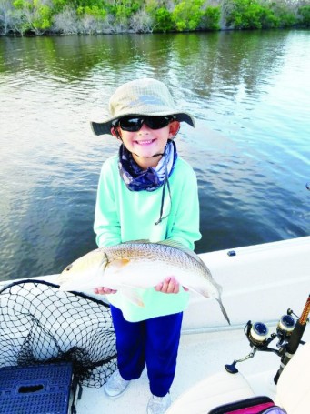 On his last day of summer vacation 7  year old Isaac Taylor caught this 22 inch Red Fish while fishing with his grandpa on the Indian River