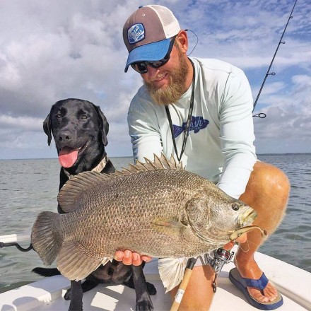 Capt. Jordan Todd and Murphy dog with a nice triple tail