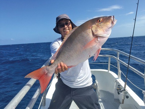 Orlando with a slob mutton snapper caught aboard the Catch My Drift.