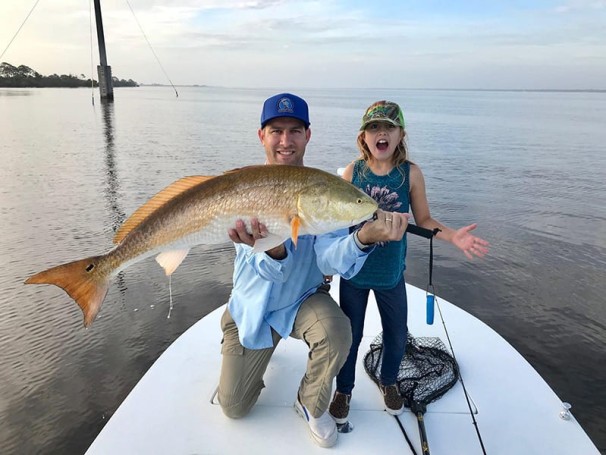 Jerad Merbitz and daughter Liana with their redfish on the NIRL.