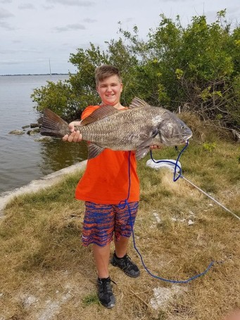 Brett Jenkins (12 yrs old) with this MONSTER Black Drum - His 1st ever!