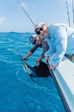 Kevin with his first sail. The fish ate a live herring fished off the kite while fishing the edge with Capt. Orlando Muniz.