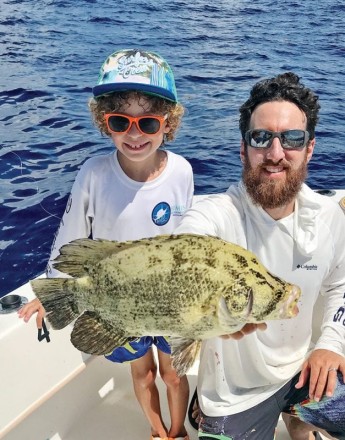 This youngster caught his first tripletail aboard Bouncer’s Dusky 33.