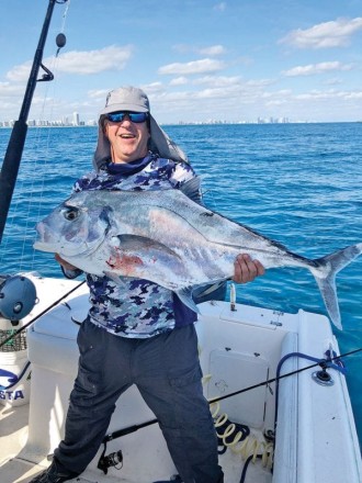 Hector Martinez with an African pompano caught off Miami Beach on a live sardine.