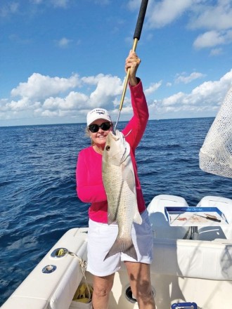Sally Stribling slayed a slob of a mangrove snapper drifting a live ballyhoo off Key Largo.