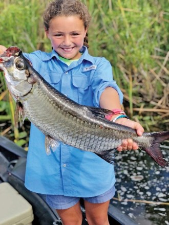 Grayson, 11, had an epic time catching this 4 lb. baby tarpon