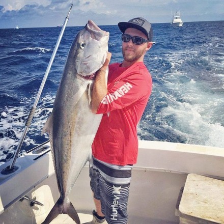 Josh with a nice amberjack.
