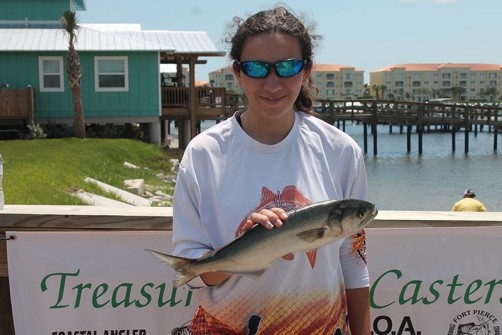 Ciara Franqui with a 2.10-pound bluefish. Photo credit: Treasure Coast Casters.