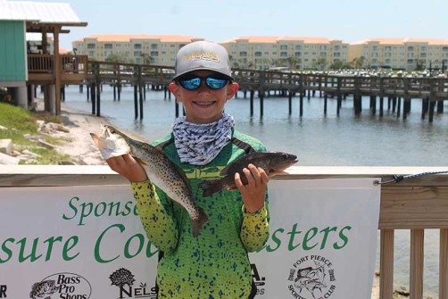Owen Nail with a trout and snapper. Photo credit: Treasure Coast Casters.