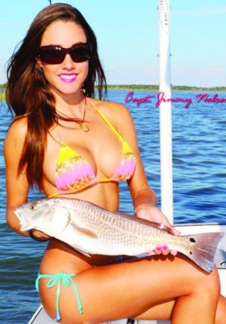 Luiza shows off a nice Redfish. For more information on this amazing lady angler, go to: www.fishingwithluiza.com