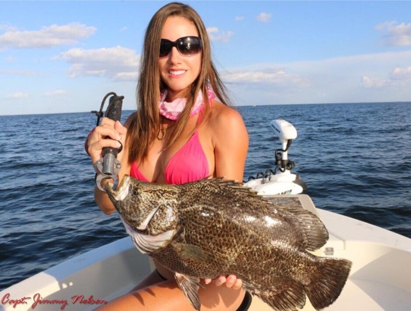 Luiza shows off a nice Tripletail. Learn more about this amazing lady angler: www.fishingwithluiza.com