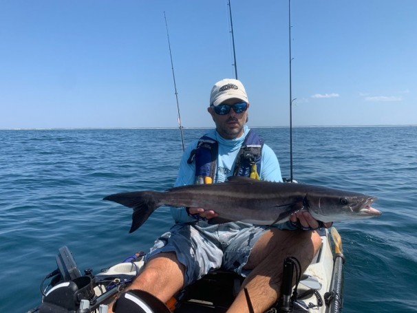 Benton Parton shows off a nice cobia caught from his Hobie kayak.