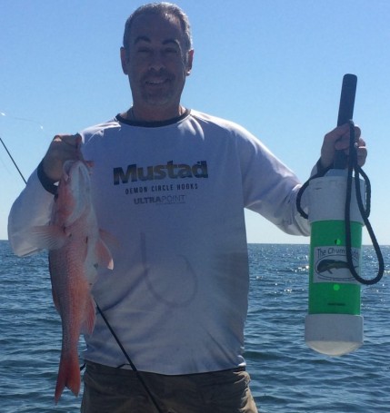Paul Caruso shows off the benefits of using his Chum Buddy to bring up the red snapper.
