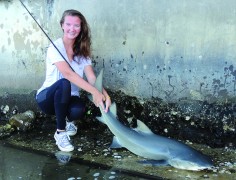 Emily Hanzlik and a nice lemon shark caught on light tackle on a seawall in the Lake Worth Intracoastal.