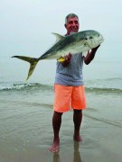 Pete Moccia with a beautiful jack he caught from the surf.