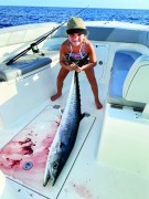 Kinley caught this 30 lb. kingfish while  fishing with her mom and dad off of Jupiter. The king ate a 2 lb. blue runner while  drifting in 100-125 feet of water.
