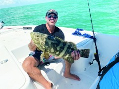 Jeremy getting his hands full with a good sized goliath grouper over at Chokoloskee.