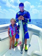 Kinley and her dad Bryan with a  38 lb. wahoo that she caught.