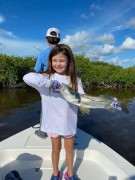6 year old Adriana caught her first snook in Key largo on cut herring.