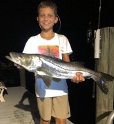 11 year old Michael Daddono fought, landed, and released a 30 inch snook on a live finger mullet under a bright moon and a very high tide in the Loxahatchee River.