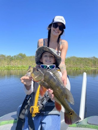 Ali and Zane in the Everglades with Captain Roy Singer.