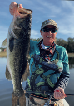 Karen Massey all smiles catching several nice bass fifishing with Capt. Mo from American Tackle