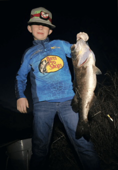 Jase Adkins with a 7lb plus bass caught night fishing for Crappie, Big Surprise!