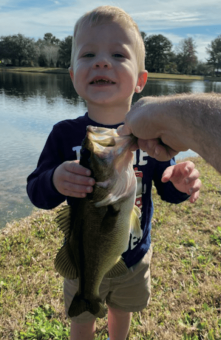 2 1/2 yr old Cameron Ledesma with his 1st Bass from private pond, caught by himself!