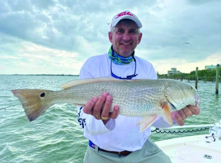 Capt. Terry Fisher putting his clients on nice redfish!