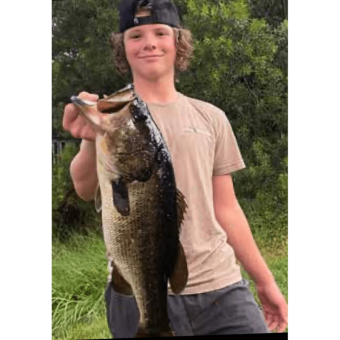 Hayden Wolf with "Biggin" he caught in a private pond in Chuluota