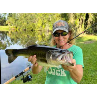 Deanna Jenkins with a “Biggin” she caught in a private pond with her new rod she built at Mud Hole rod building class!!