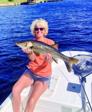 Beki w/ a nice snook from a canal in Cape Coral.