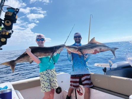 Caleb Louth (L) & 49.5” cobia with Brent Louth (R) & 48.5” cobia, 60 miles offshore Sarasota.