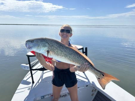 Daughter Site fishing a nice school of oversized Red Fish!