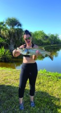 Jenna Hudik of NFM with her first snook, w/ the help of her husband!
