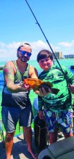 Landon James(r) stepdad Bryan Zeller(l) caught this cutie under the Sanibel Causeway Bridge.