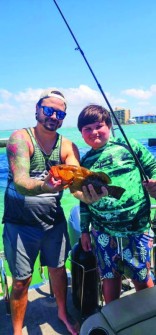 Landon James(r) stepdad Bryan Zeller(l) caught this cutie under the Sanibel Causeway Bridge.