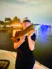 Ryan, 14, with a nice redfish in Cape Coral.