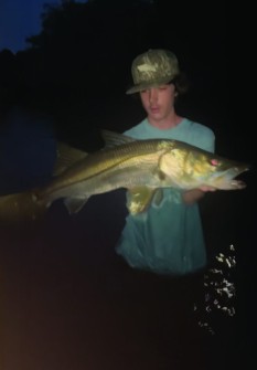 Collin Malloy w/ a 36” snook caught in Matlacha