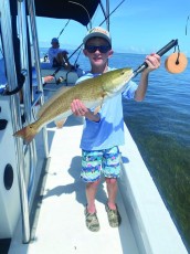9 yo Cash caught this beautiful red out fishing with his dad.